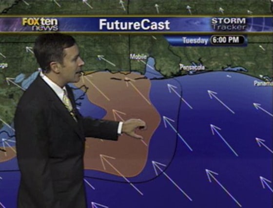 In this July 13 image taken from video provided by WALA-TV FOX10, meteorologist Jason Smith shows viewers in Mobile, Ala., the projected path of oil spewing from the Deepwater Horizon rig in the Gulf of Mexico.